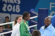 Deutsch: Boxen bei den Olympischen Jugendspielen 2018 Tag 12, 18. Oktober 2018 - Medaillenzeremonie im Fliegengewicht der Mädchen - Gold: Martina La Piana (Italien), Silber: Adijat Gbadamosi (Nigeria), Bronze: Heaven Destiny Garcia (USA); Medaillenübergabe durch Habu Gumel (IOC, Nigeria), Geschenkübergabe durch Dr. Joseph O. Ayeni (Nigeria, AIBA). English: Boxing at the 2018 Summer Youth Olympics on 18 October 2018 – Girl's flyweight Medal Ceremony - Gold: Martina La Piana (Italy), Silver: Adijat Gbadamosi (Nigeria), Bronze: Heaven Destiny Garcia (USA); Medal handover by Habu Gumel (IOC, Nigeria), Gift presented by Dr. Joseph O. Ayeni (Nigeria, AIBA). Español: Boxeo en los Juegos Olímpicos Juveniles de Verano de 2018 en 18 de octubre de 2018 - Ceremonia de la Medalla de peso mosca para niñas - Oro: Martina La Piana (Italia), Plata: Adijat Gbadamosi (Nigeria), Bronce: Heaven Destiny Garcia (Estados Unidos); Entrega de medallas por Habu Gumel (COI, Nigeria), Regalo presentado por Joseph O. Ayeni (Nigeria, AIBA).