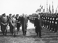Storbritannias statsminister Neville Chamberlain (venstre) og Frankrikes Statsminister Édouard Daladier ankommer München den 29. september 1938.