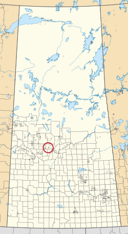 Mapa provincie Saskatchewan zobrazující 297 venkovských obcí a stovky malých indických rezerv. Jeden je zvýrazněn červeným kruhem.