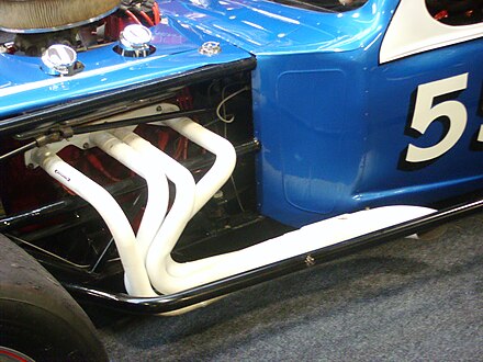 Ceramic-coated exhaust manifold on the side of a performance car
