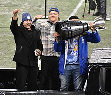Zach Collaros (left) as Andrew Harris raises the Grey Cup at Winnipeg's 2021 Grey Cup celebration. Collaros Miller 2021 Grey Cup Celebration.jpg
