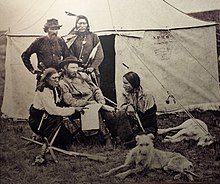 Custer and Bloody Knife (kneeling left), Custer's favorite Indian Scout Custer Staghounds.jpg