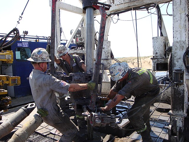 Roughnecks on a drilling rig