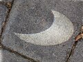 Eclipsed Sun projected onto the ground (2251326651).jpg