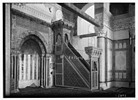 The original minbar installed under Saladin. The mihrab is visible to the left.