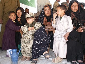 A multi-generational extended family in Chaghcharan, Ghor Province, Afghanistan. Extended Family (4197770551).jpg