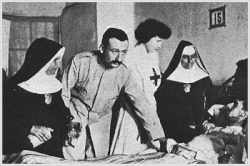 Fidel Pages visiting an injured man at the Docker Hospital in Melilla, Spain during the Second Melillan campaign in 1909. The Docker Hospital was renamed after Pages in 1926. Fidel Pages visiting an injured person in Melilla in the 1909 campaign.gif