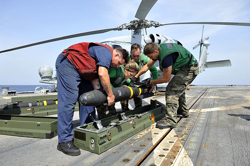 File:Flickr - Official U.S. Navy Imagery - Sailor lower a Hellfire missile into it's case..jpg