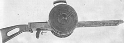 Gast machine gun with drum magazines.jpg