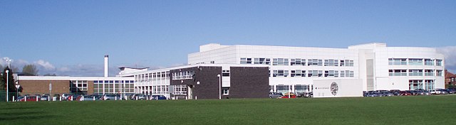 Gosforth High's buildings as they appeared in 2007. The white 2002 building is on the right side, and an additional structure has since been built to 