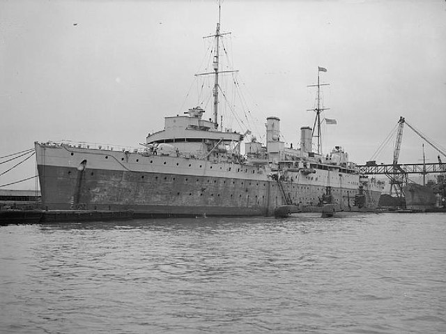 HMS Maidstone in the harbour of Algiers. Alongside are HMS Safari and HMS Sahib