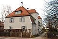 Doppelwohnhaus Vockestraße 103 auf dem Gelände des Isar-Amper-Klinikum München-Ost (zuvor Bezirkskrankenhaus Haar, davor Kreis-Heil- und Pflegeanstalt Haar) in Haar, Landkreis München, Regierungsbezirk Oberbayern, Bayern. Als Baudenkmal unter Aktennummer D-1-84-123-9 in der Bayerischen Denkmalliste aufgeführt.