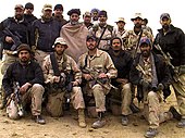 Operational Detachment Alpha 574 of the U.S. Army Special Forces alongside Hamid Karzai at Kandahar Province in October 2001. Hamid Karzai and US Special Forces.jpg