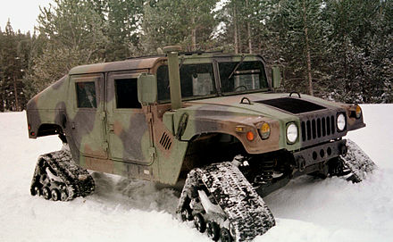 At the Bridgeport, California Mountain Warfare Training Center in March 1997, a test HMMWV drives through the snow, equipped with Mattracks treads.