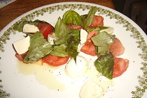 English: tomatoes, mozzarella cheese, basil, e...