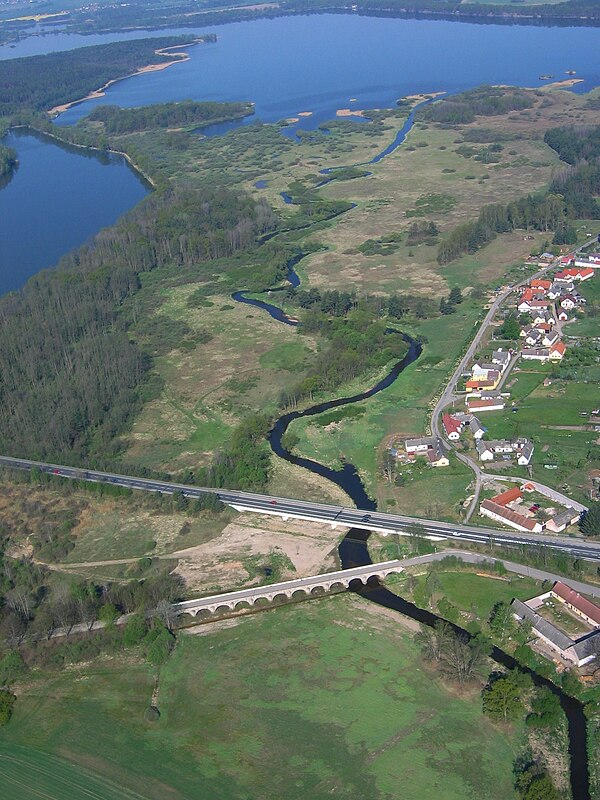 Rožmberk Pond on the river; inundation bridge at Stará Hlína in the foreground