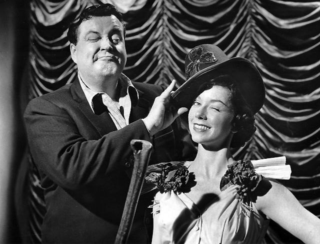 Gleason and June Taylor dancer Margaret Jeanne get ready for St. Patrick's Day 1955.
