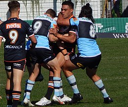 Ofahengaue turned around in the tackle for the Wests Tigers against the Cronulla Sharks in 2021 Joseph Ofahengaue.jpg