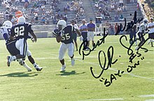 Signed photograph of Junior Seau (#55) at Charger training camp - also pictured are Tony Martin (#81), David Griggs (#92) and Mark Seay (#82) Junior Seau 1994.jpg