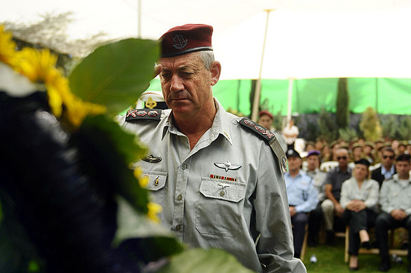 Israel Defense Forces Former Chief of Staff Lt. Gen. Benny Gantz salutes Yom Kippur War casualties at an official annual memorial service for fallen s