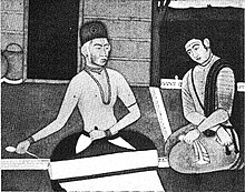 Painting of bhagat (saint) Kabir (left) with a disciple (right), Mughal school of art.jpg