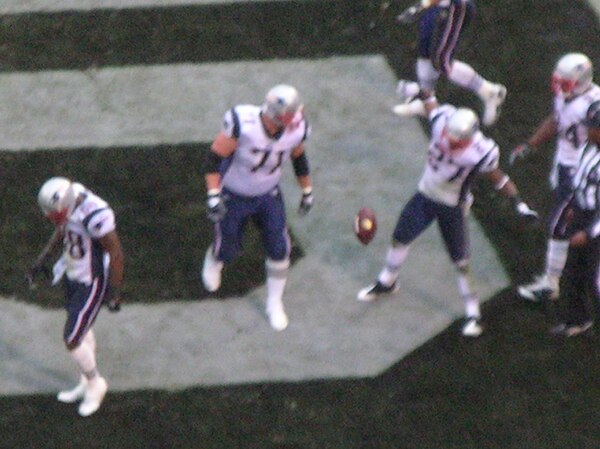 Hobbs (right) celebrates his kickoff return for a touchdown.