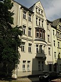 Tenement house in almost half-open development