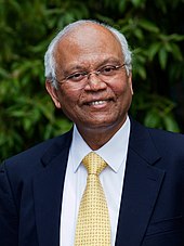 Portrait photograph of a smiling man.