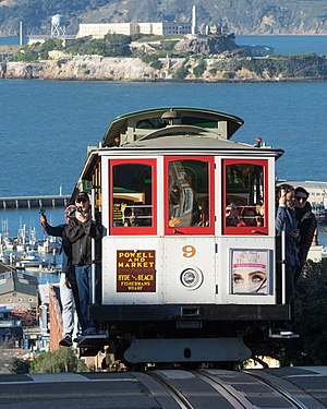 San Francisco Cable Car #9 on Hyde Street. In the background Alcatraz Island.