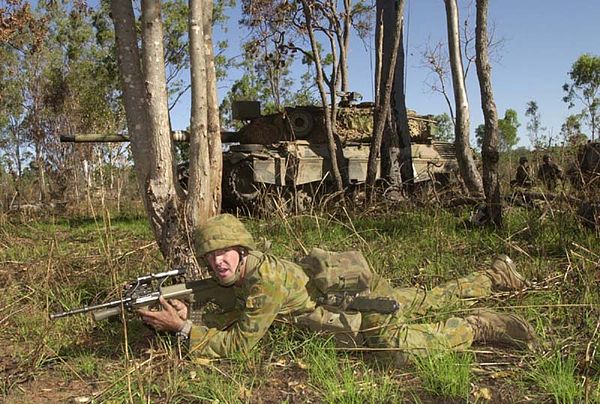 A soldier of the 5/7th Battalion, The Royal Australian Regiment, conducts fire and movement during training.
