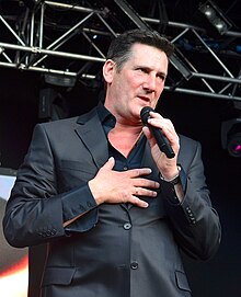 Tony Hadley went from being sceptical of the song's potential to seeing how its sudden popularity made topping the UK pop chart inevitable. Tony Hadley of Spandau Ballet (14521418016).jpg