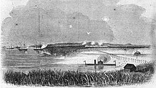 The USS Montauk attacks Fort McAllister; the 1st Georgia Sharpshooters being among the defenders. USS Montauk 8harpers1863.jpg