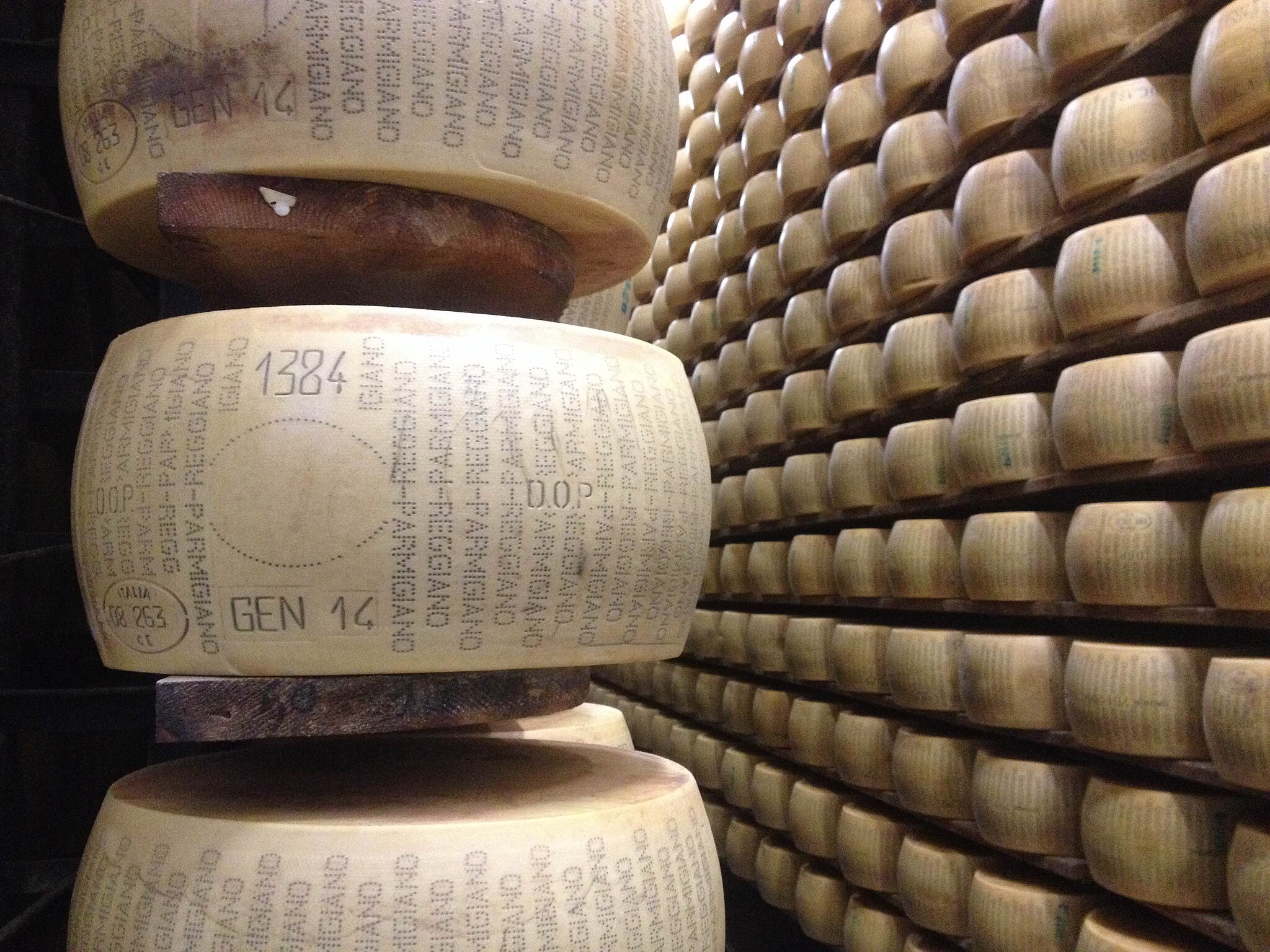 Unapproved Parmigiano-Reggiano wheel on shelf