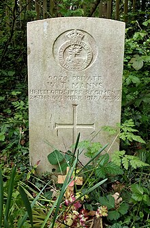 The grave of William Manns of the Hertfordshire Regiment at St James the Great. Manns was born in Friern Barnet and baptised at St James's in 1898. He died in 1918. W.T. Manns Hertfordshire Regiment grave St James the Great, Friern Barnet.jpg