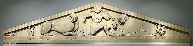 The Gorgon as depicted on the western pediment from the Artemis Temple of Corfu, on display at the Archaeological Museum of Corfu.
