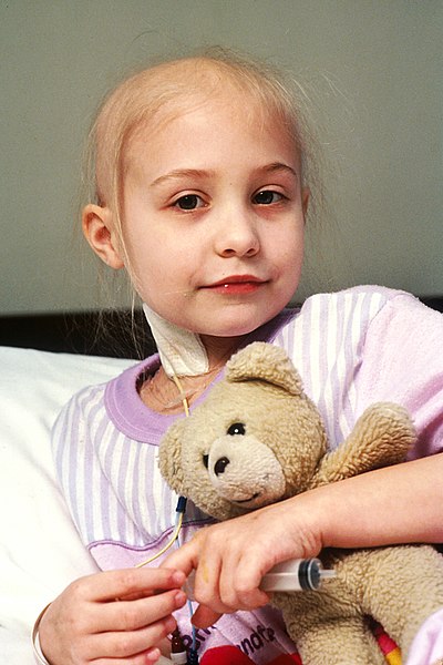 File:Young patient holds teddy bear.jpg
