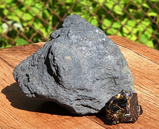 <span class="mw-page-title-main">Shungite</span> Type of solid bitumen, or rock containing solid bitumen