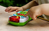 Rank: 5 Baby plays with Scout's Learning Lights Remote