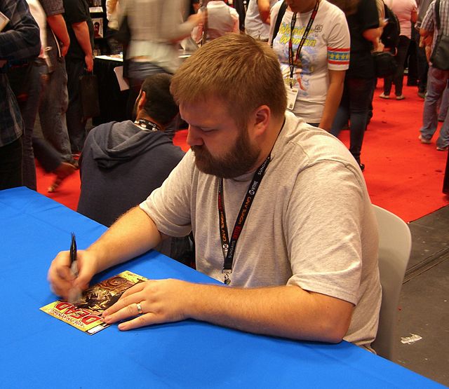 Co-creator Robert Kirkman signing a copy of the first issue at the 2011 New York Comic Con.