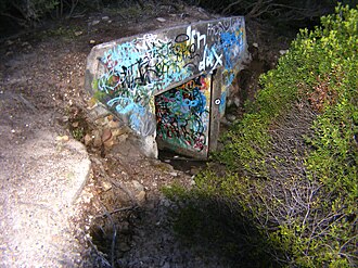 The main tunnel entrance to the Malabar Battery with the tram line running into it. 2007 - Main tunnel entrance to the Malabar Battery.jpg