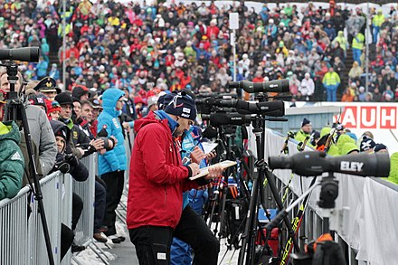 Biathlon coaches use spotting scopes to verify and optimize competitors shot placement