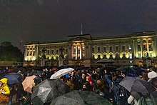 Hundreds of people gathered outside the gates of Buckingham Palace in the rain. 20220908-Buckingham Palace Elizabeth II death reactions (09).jpg