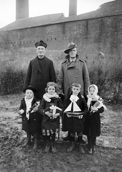 File:A Belgian priest and an Australian padre with some village children (2864504394).jpg