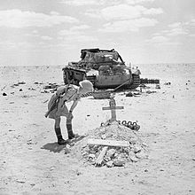 A British soldier inspects the grave of a German tank crewman, killed when his PzKpfw III tank was knocked out in the battle, 29 September 1942. A British soldier inspects the grave of a German tank crewman, killed when his PzKpfw III tank was knocked out in the Western Desert, 29 September 1942. E17549.jpg