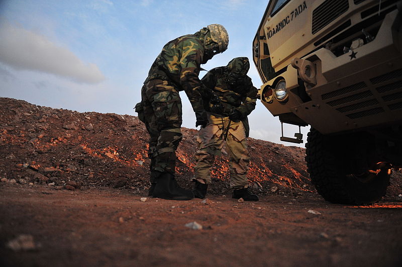 File:A U.S. Soldier, left, with the 5th Battalion, 7th Air Defense Artillery Regiment assists his battle buddy in donning protective gear before a simulated chemical attack during Austere Challenge 2012 in Beit Ezra 121023-F-QW942-195.jpg