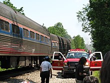 First responders at the site of a train collision in the United States Amfleet cars and first responders after July 2011 grade crossing accident.jpg