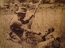 ANZAC soldier giving a wounded Turk a drink Anzacwoundedturk.JPG