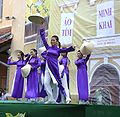 Female students wearing purple ao dai are dancing, January 2009