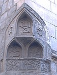 Beveled or chamfered corner of the mosque with three muqarnas niches.