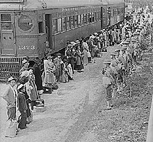 Japanese Americans arrive for Internment processing. Arrivals.jpg